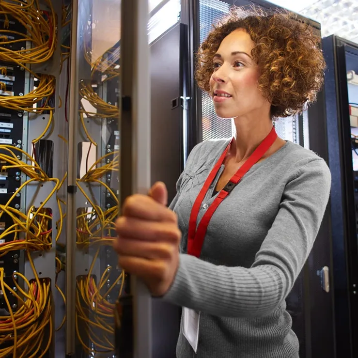 woman representing server management companies in data center